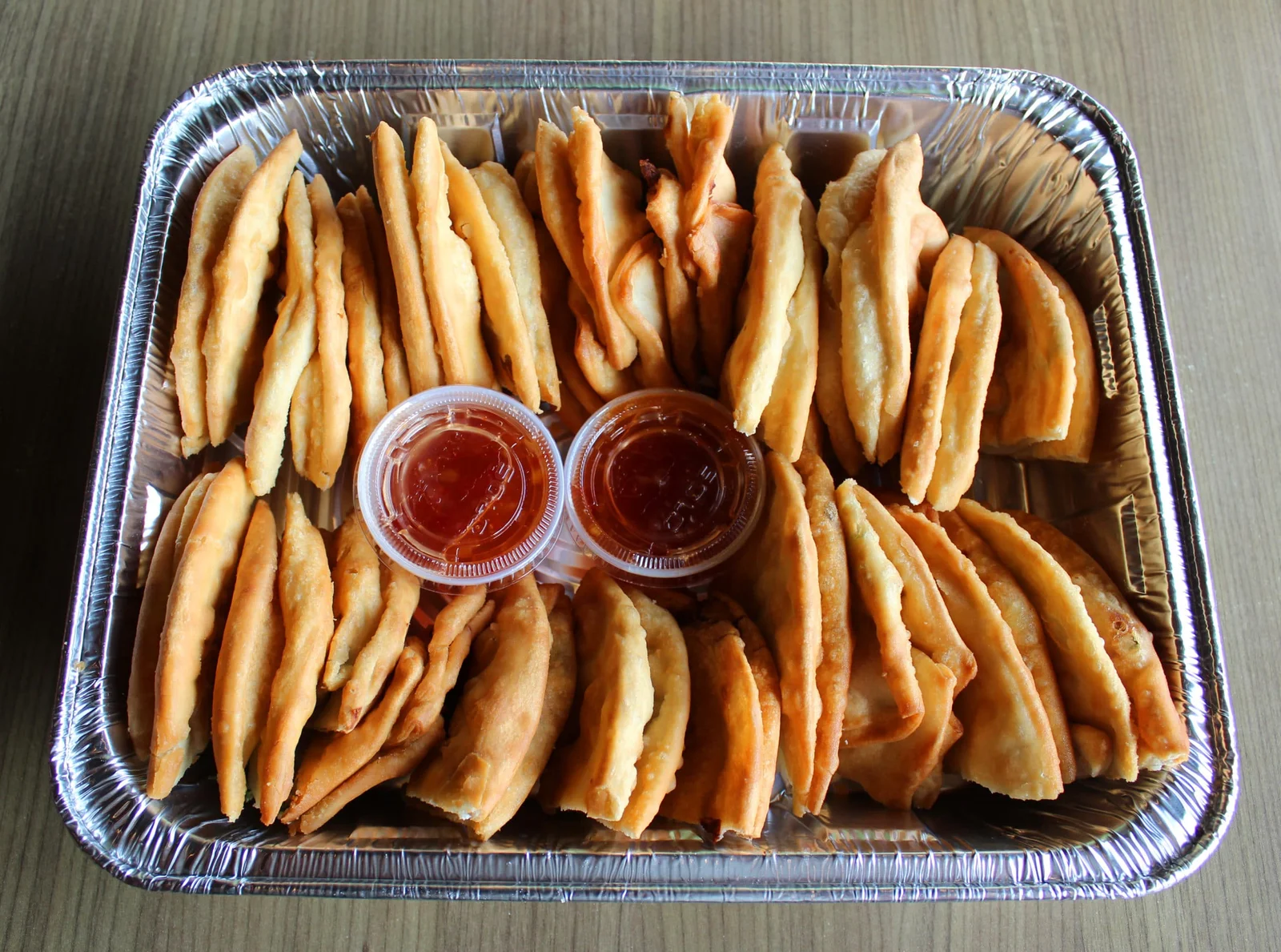 Tray of spring rolls with dipping sauce